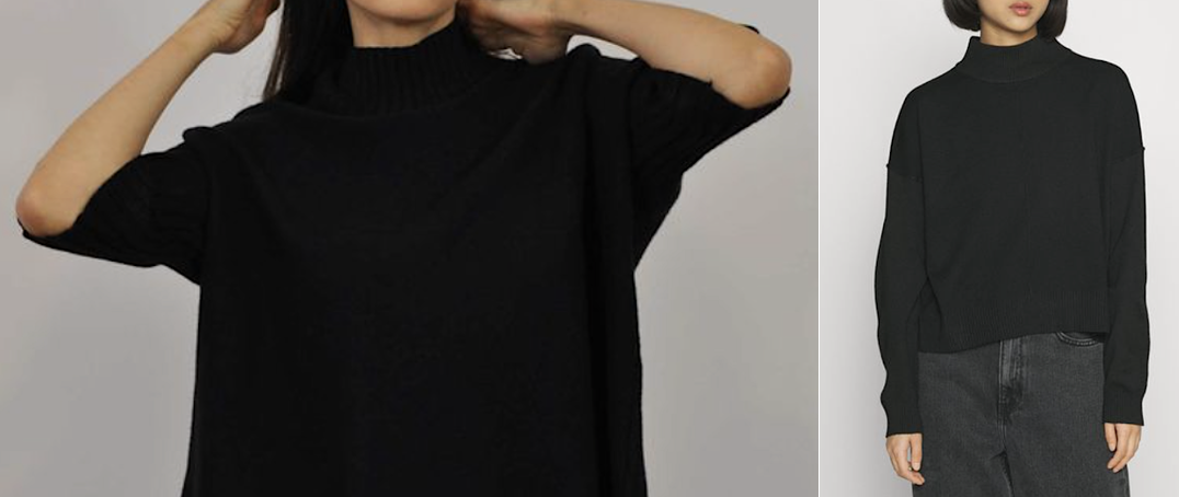 A warm funnel/chimney neck sweater laid out on a neutral background