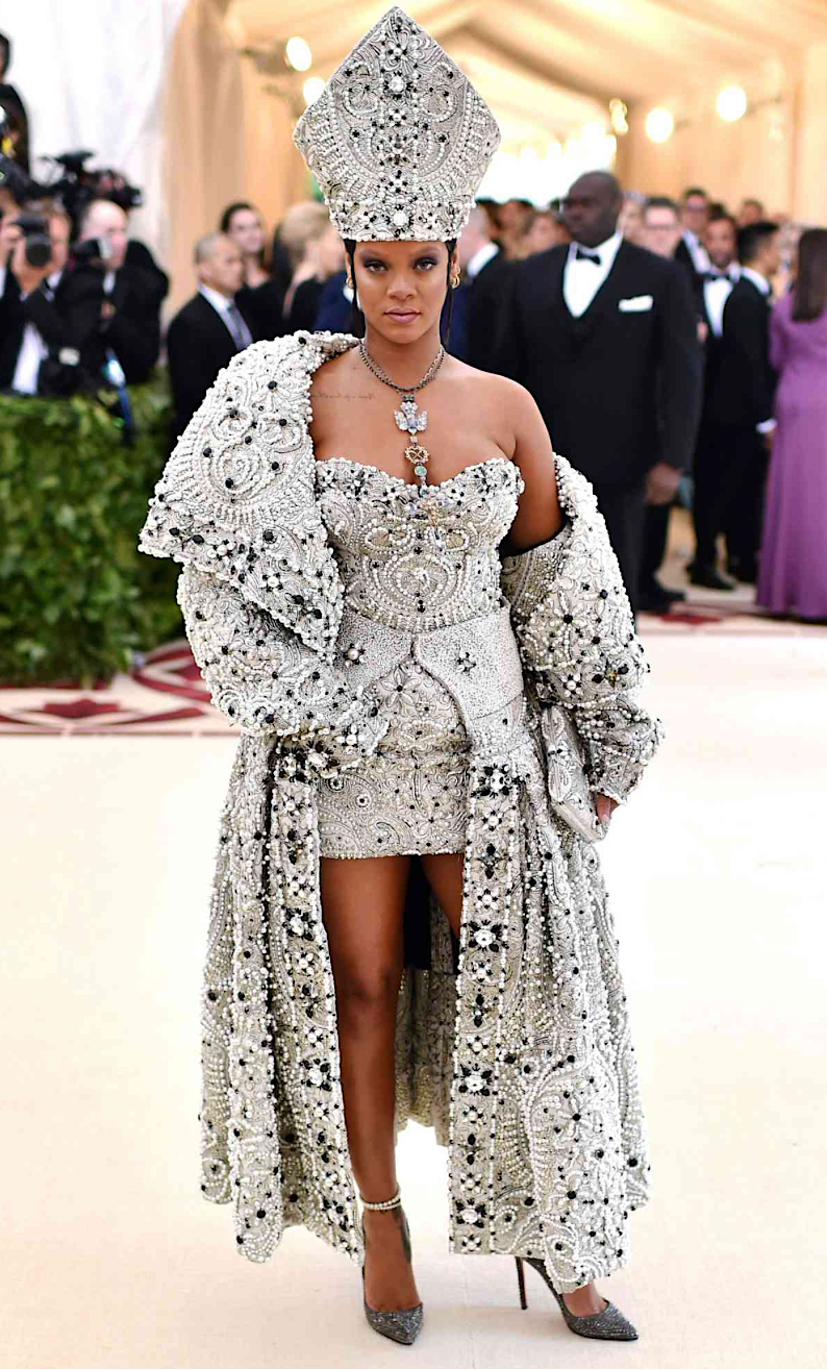 Rihanna at the 2018 Met Gala wearing a papal-inspired beaded ensemble with a bejeweled mitre